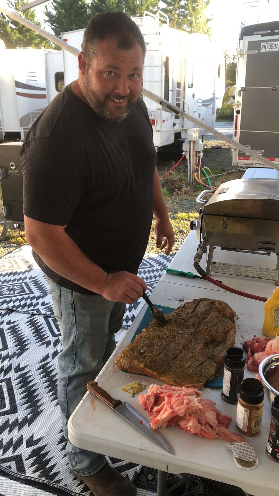 Ryan preparing food at an outdoor community gathering in Lanark Highlands.