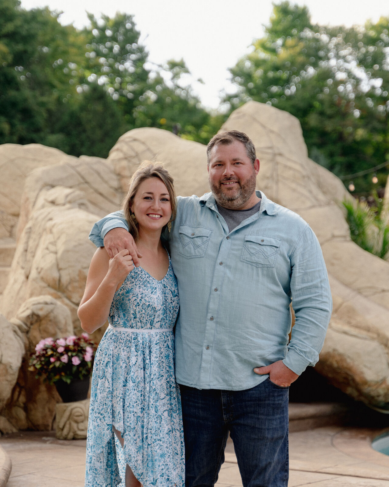 Ryan and his partner Tausha standing together outdoors near a lake in Lanark Highlands.